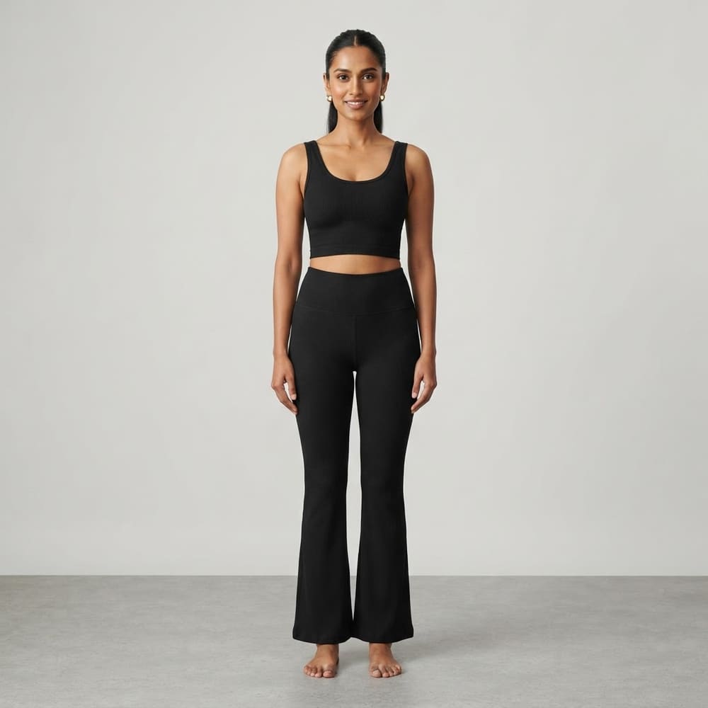 Indian woman wearing META NEST ACTIVEWEAR ButterRib Flare Pants in Noir Black